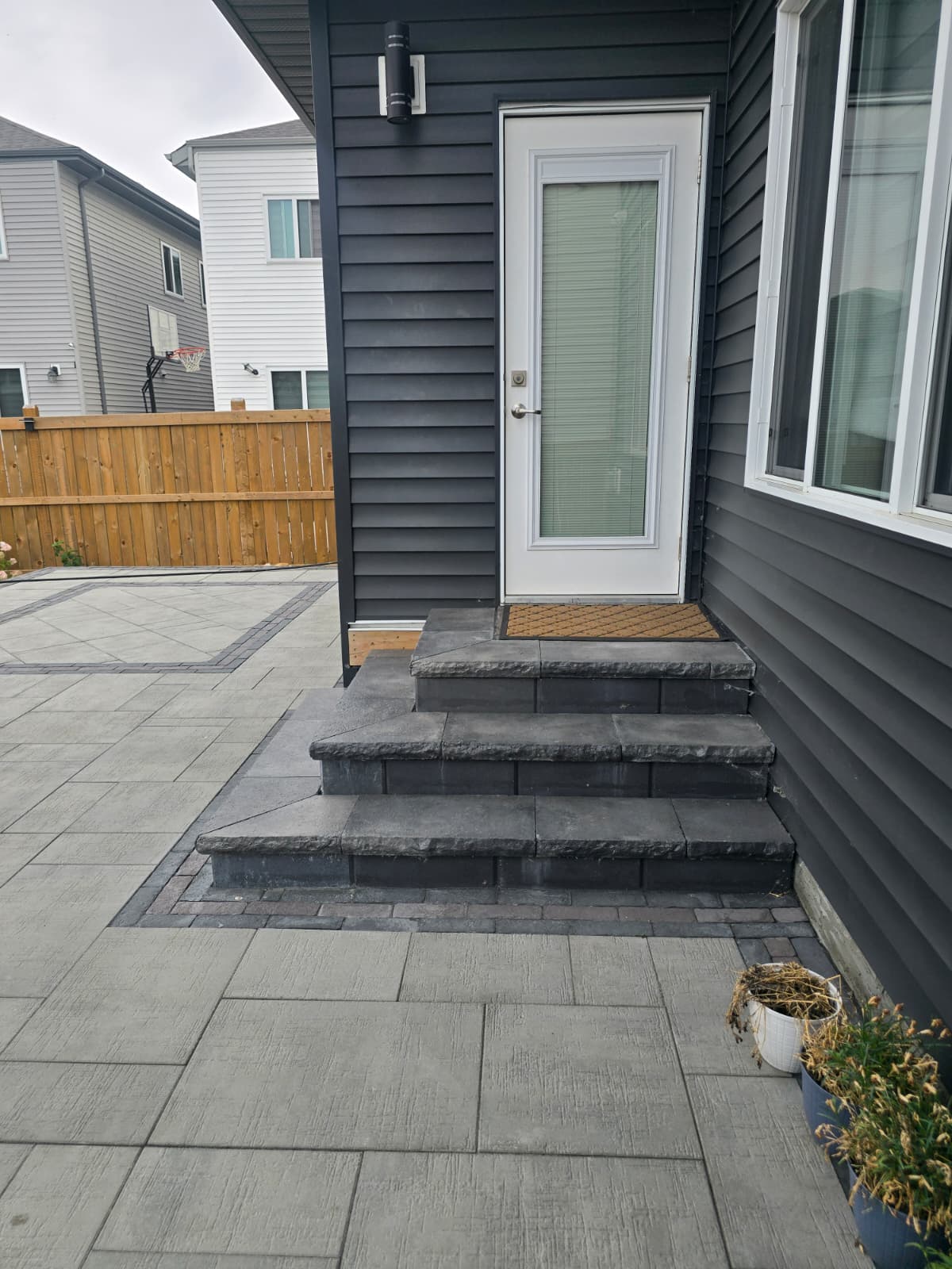 Dark tone stone steps leading to patio — Edmonton