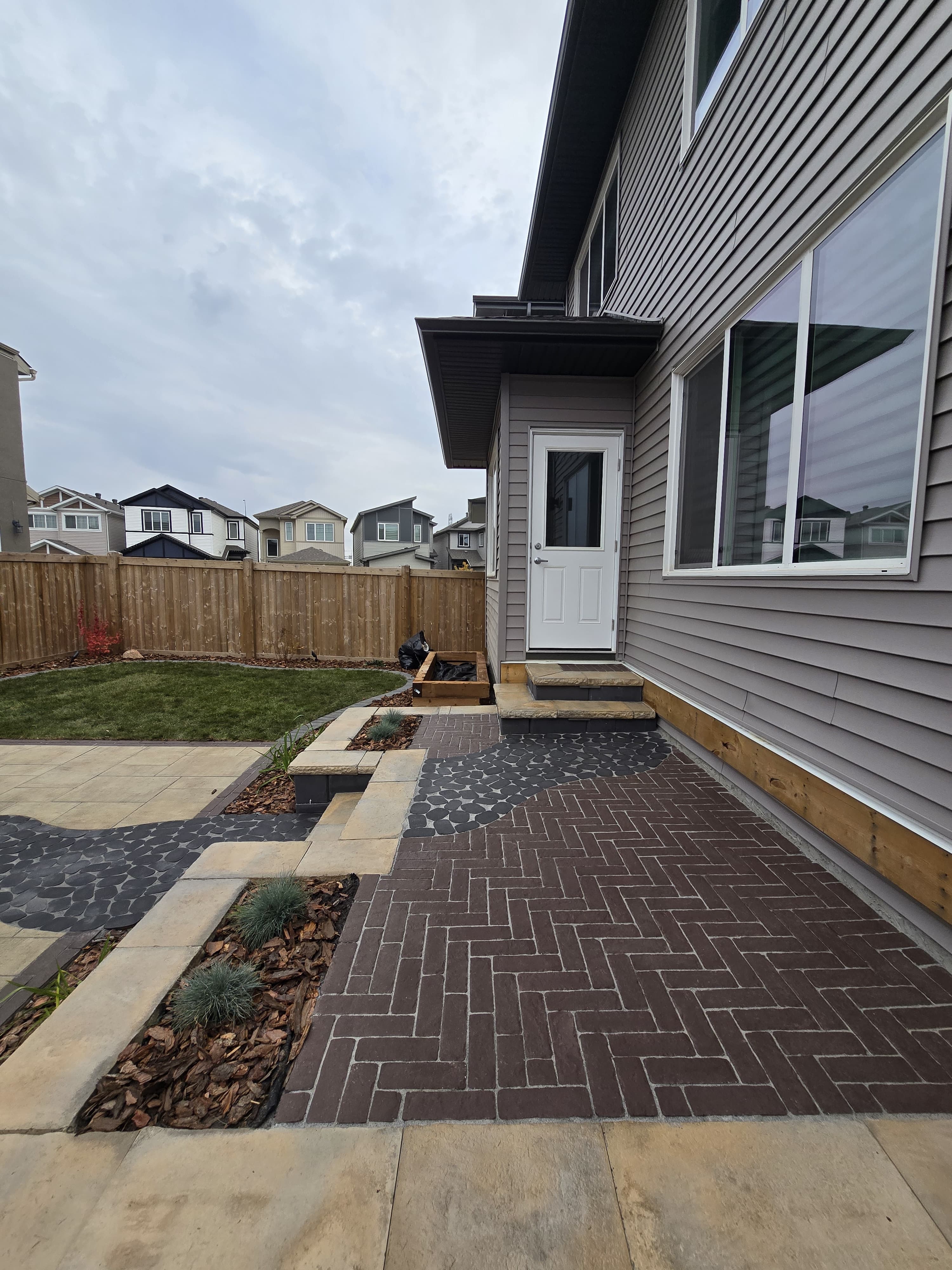 Herringbone paver sideyard entry — Edmonton