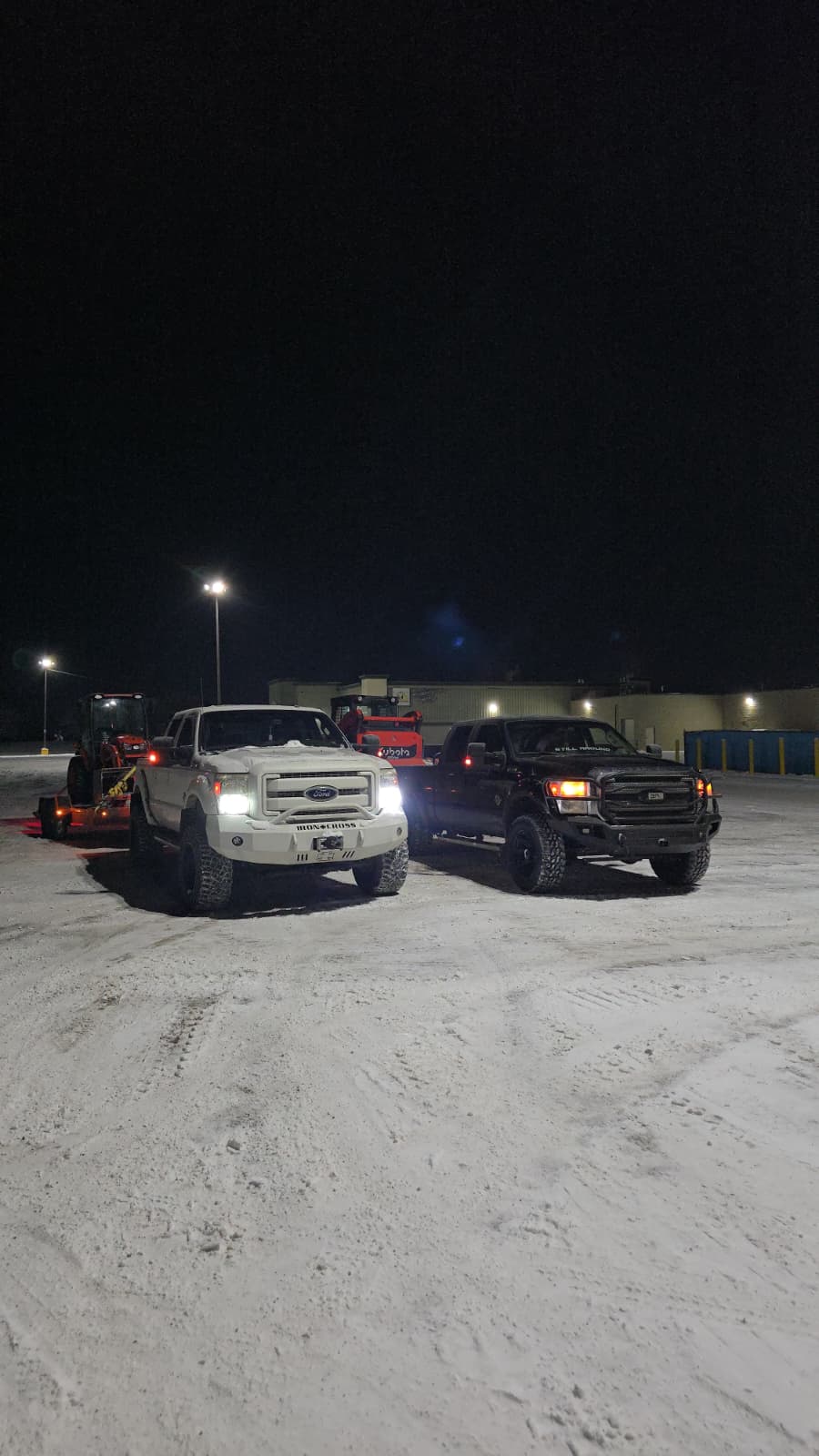 Garden Guys snow removal trucks ready for night operation in Edmonton
